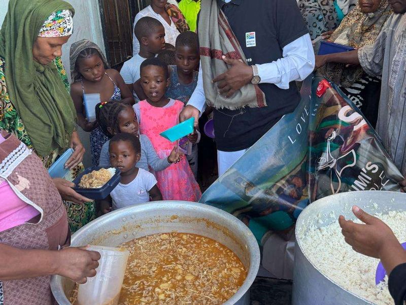 Children with plates of hot food in South Africa