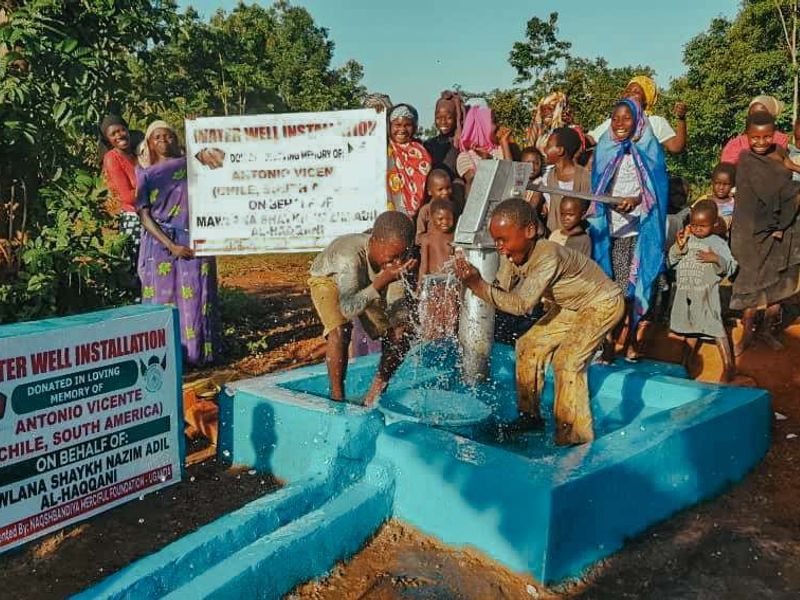 The handover of a water well in Uganda